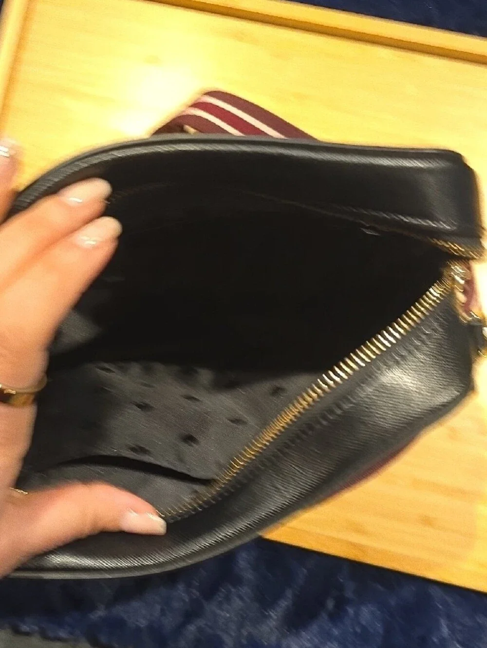 kate spade Lauryn black leather camera bag with burgundy striped strap
